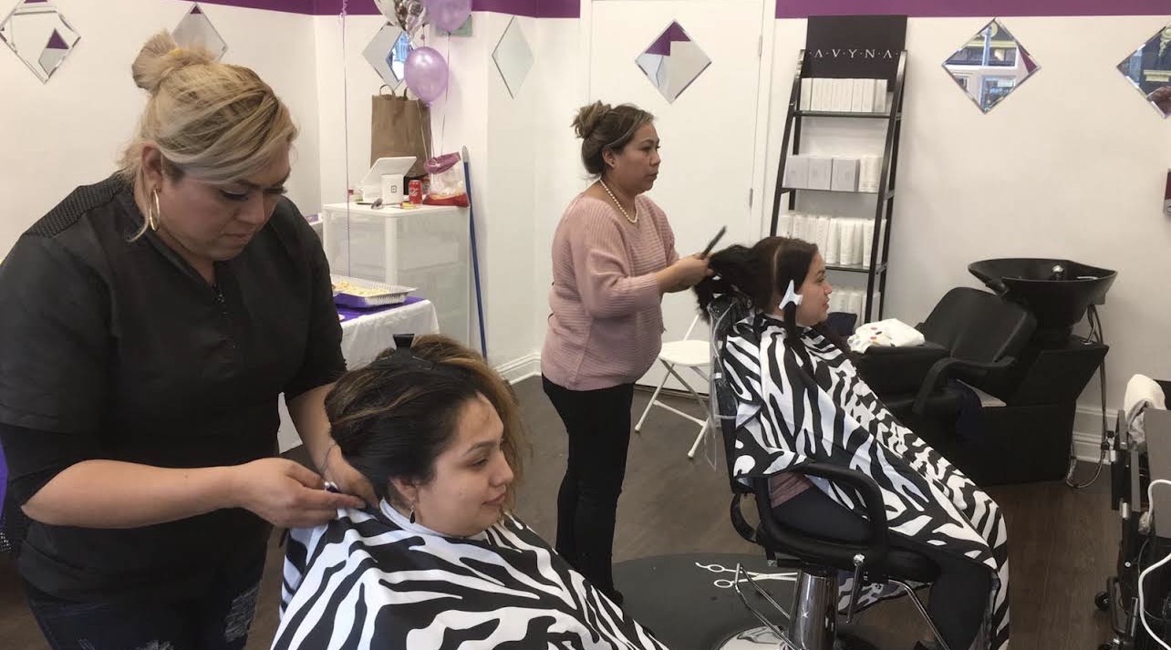 Our barbers working with clients